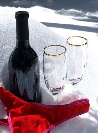 To use this stock image in your creative project, please select the size you need over to the right and click the "Add to Cart" button.
Your downloaded image will come with the Cutcaster watermark removed so don’t worry about the watermark you see on this page. Wine, glases and red bikini in snow stock photo, Enticing setting ofwine, crystal glasses and red bathing suit in the snow by Jill Reid