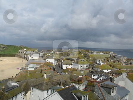 To use this stock image in your creative project, please select the size you need over to the right and click the "Add to Cart" button.
Your downloaded image will come with the Cutcaster watermark removed so don’t worry about the watermark you see on this page. The roofs of St Ive stock photo, A view overlooking St Ives by Colin Elves