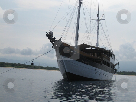 To use this stock image in your creative project, please select the size you need over to the right and click the "Add to Cart" button.
Your downloaded image will come with the Cutcaster watermark removed so don’t worry about the watermark you see on this page. Schooner stock photo, An old wooden schooner by Colin Elves