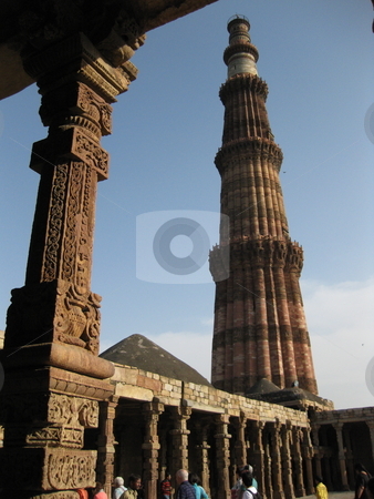 To use this stock image in your creative project, please select the size you need over to the right and click the "Add to Cart" button.
Your downloaded image will come with the Cutcaster watermark removed so don’t worry about the watermark you see on this page. Qutub Minar stock photo, The Qutub Minar, New Delhi, Framed by the pillars and halls of the nearby ruined mosque by Colin Elves