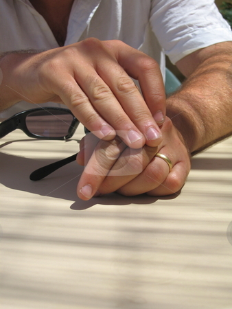 To use this stock image in your creative project, please select the size you need over to the right and click the "Add to Cart" button.
Your downloaded image will come with the Cutcaster watermark removed so don’t worry about the watermark you see on this page. Married Man's hands stock photo, A self portrait of my hands, showing my wedding ring by Colin Elves