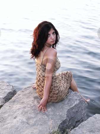 To use this stock image in your creative project, please select the size you need over to the right and click the "Add to Cart" button.
Your downloaded image will come with the Cutcaster watermark removed so don’t worry about the watermark you see on this page. Lady on the lake stock photo, An lovely young lady sitting on a big rock on the lake relaxing by sunset. by Horst Petzold
