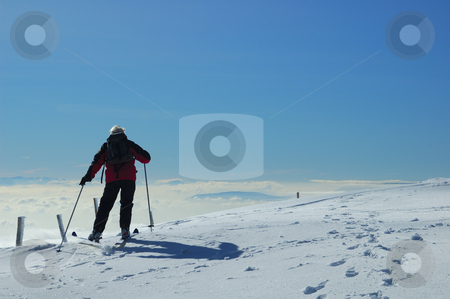 To use this stock image in your creative project, please select the size you need over to the right and click the "Add to Cart" button.
Your downloaded image will come with the Cutcaster watermark removed so don’t worry about the watermark you see on this page. Jurassic skier stock photo, A skier sets off across a gentle snow-covered slope, high on a mountain in the Swiss Jura range. Below him the valley is filled with cloud and, far off in the distance, peaks of the Alps can be faintly seen. by Alistair Scott