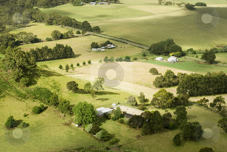 To use this stock image in your creative project, please select the size you need over to the right and click the "Add to Cart" button.
Your downloaded image will come with the Cutcaster watermark removed so don’t worry about the watermark you see on this page. Small Rural Farms stock photo, View from above of a patchwork of fields and small farmsteads, Victoria, Australia by Stephen Gibson