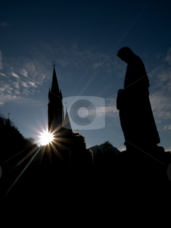 To use this stock image in your creative project, please select the size you need over to the right and click the "Add to Cart" button.
Your downloaded image will come with the Cutcaster watermark removed so don’t worry about the watermark you see on this page. Lourdes basilica stock photo, Silhouette of the Basilica of the Immaculate Conception in Lourdes with statue of the virgin Mary by Laurent Dambies