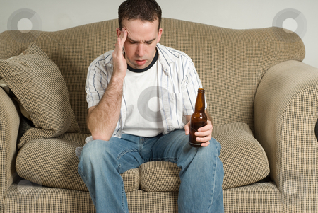 To use this stock image in your creative project, please select the size you need over to the right and click the "Add to Cart" button.
Your downloaded image will come with the Cutcaster watermark removed so don’t worry about the watermark you see on this page. Man With Drinking Problem stock photo, A young man with a drinking problem is feeling depressed by Richard Nelson