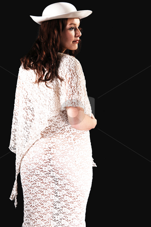 To use this stock image in your creative project, please select the size you need over to the right and click the "Add to Cart" button.
Your downloaded image will come with the Cutcaster watermark removed so don’t worry about the watermark you see on this page. Woman with hat. stock photo, Beautiful lady in a beige long dress and hat standing in the studio
smiling, for black background. by Horst Petzold