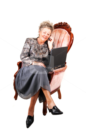 To use this stock image in your creative project, please select the size you need over to the right and click the "Add to Cart" button.
Your downloaded image will come with the Cutcaster watermark removed so don’t worry about the watermark you see on this page. Business woman in armchair. stock photo, Busy businesswoman talking on the cell phone and working also on the
laptop, sitting in a pink armchair, over white background. by Horst Petzold
