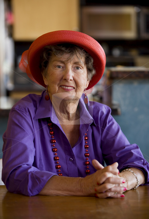 To use this stock image in your creative project, please select the size you need over to the right and click the "Add to Cart" button.
Your downloaded image will come with the Cutcaster watermark removed so don’t worry about the watermark you see on this page. Senior Woman Wearing Red Hat stock photo, Friendly senior woman wearing a red hat by Scott Griessel