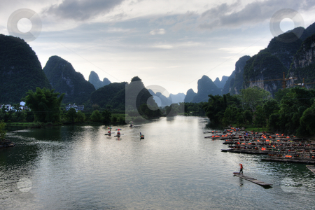 To use this stock image in your creative project, please select the size you need over to the right and click the "Add to Cart" button.
Your downloaded image will come with the Cutcaster watermark removed so don’t worry about the watermark you see on this page. Mountain landscape stock photo, Li river karst mountain landscape in Yangshuo, China by Christopher Meder