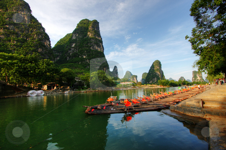 To use this stock image in your creative project, please select the size you need over to the right and click the "Add to Cart" button.
Your downloaded image will come with the Cutcaster watermark removed so don’t worry about the watermark you see on this page. Mountain landscape stock photo, Li river karst mountain landscape in Yangshuo, China by Christopher Meder