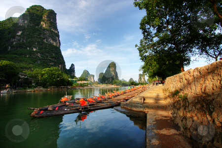 To use this stock image in your creative project, please select the size you need over to the right and click the "Add to Cart" button.
Your downloaded image will come with the Cutcaster watermark removed so don’t worry about the watermark you see on this page. Mountain landscape stock photo, Li river karst mountain landscape in Yangshuo, China by Christopher Meder
