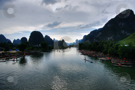 To use this stock image in your creative project, please select the size you need over to the right and click the "Add to Cart" button.
Your downloaded image will come with the Cutcaster watermark removed so don’t worry about the watermark you see on this page. Mountain landscape stock photo, Li river karst mountain landscape in Yangshuo, China by Christopher Meder