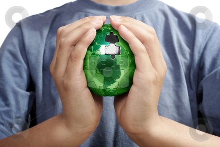 To use this stock image in your creative project, please select the size you need over to the right and click the "Add to Cart" button.
Your downloaded image will come with the Cutcaster watermark removed so don’t worry about the watermark you see on this page. The Missing Piece, Green Energy stock photo, Earth puzzle, held by a young boy looking for solution by Christopher Meder