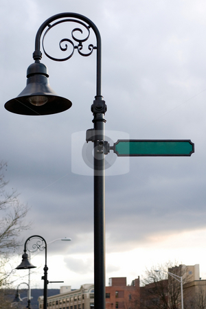 To use this stock image in your creative project, please select the size you need over to the right and click the "Add to Cart" button.
Your downloaded image will come with the Cutcaster watermark removed so don’t worry about the watermark you see on this page. Blank Street Sign stock photo, A blank street sign and lamp post with copyspace ready for your text. by Todd Arena