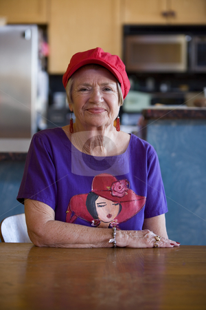 To use this stock image in your creative project, please select the size you need over to the right and click the "Add to Cart" button.
Your downloaded image will come with the Cutcaster watermark removed so don’t worry about the watermark you see on this page. Senior Woman Wearing Red Hat stock photo, Friendly senior woman wearing a red hat by Scott Griessel