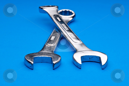 To use this stock image in your creative project, please select the size you need over to the right and click the "Add to Cart" button.
Your downloaded image will come with the Cutcaster watermark removed so don’t worry about the watermark you see on this page. Horizontal image of a pair of old worn combination wrenches on a stock photo, Horizontal image of a pair of old worn combination wrenches on a blue background by Vince Clements