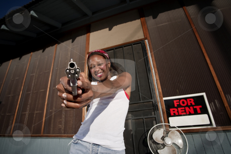 To use this stock image in your creative project, please select the size you need over to the right and click the "Add to Cart" button.
Your downloaded image will come with the Cutcaster watermark removed so don’t worry about the watermark you see on this page. Woman with Gun stock photo, African American woman with a gun on her front porch by Scott Griessel