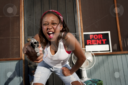 To use this stock image in your creative project, please select the size you need over to the right and click the "Add to Cart" button.
Your downloaded image will come with the Cutcaster watermark removed so don’t worry about the watermark you see on this page. Woman with Gun stock photo, African American woman with a gun on her front porch by Scott Griessel