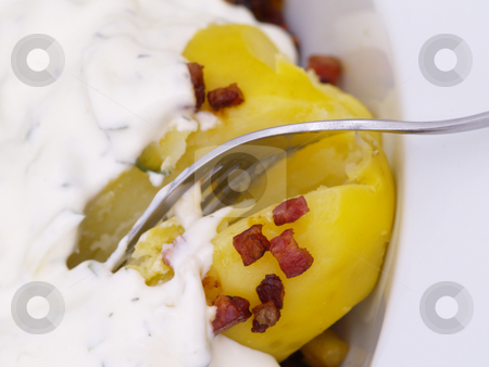To use this stock image in your creative project, please select the size you need over to the right and click the "Add to Cart" button.
Your downloaded image will come with the Cutcaster watermark removed so don’t worry about the watermark you see on this page. Potatoes stock photo, Herbs-flavoured curd and bacon on potatoes by Torsten Lorenz
