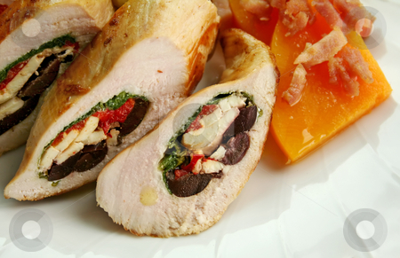 To use this stock image in your creative project, please select the size you need over to the right and click the "Add to Cart" button.
Your downloaded image will come with the Cutcaster watermark removed so don’t worry about the watermark you see on this page. Stuffed Chicken stock photo, Chicken stuffed with a Mediterranean filling made of spinach, fetta, peppers and olives with vegetables. by Brett Mulcahy
