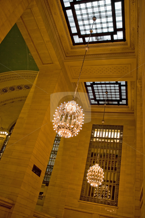 To use this stock image in your creative project, please select the size you need over to the right and click the "Add to Cart" button.
Your downloaded image will come with the Cutcaster watermark removed so don’t worry about the watermark you see on this page. Grand Central Station Interior stock photo, Grand Central Terminal interior shot of the hanging chandeliers and skylights. by Todd Arena