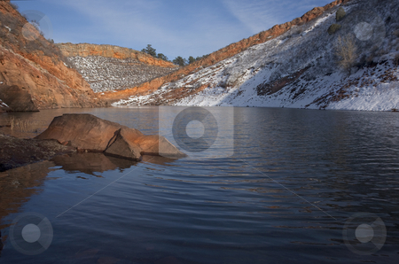 To use this stock image in your creative project, please select the size you need over to the right and click the "Add to Cart" button.
Your downloaded image will come with the Cutcaster watermark removed so don’t worry about the watermark you see on this page. Mountain lake with sandstone cliffs and snow stock photo, Mountain lake in Colorado (Horestooth Reservoir near Fort Collins) in early spring with red sandstone cliffs and snow by Marek Uliasz