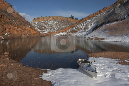 To use this stock image in your creative project, please select the size you need over to the right and click the "Add to Cart" button.
Your downloaded image will come with the Cutcaster watermark removed so don’t worry about the watermark you see on this page. Canoe and Colorado mountain lake in early spring stock photo, Canoe and Colorado mountain lake (Horestooth Reservoir near Fort Collins) in early spring with red sandstone cliffs and snow by Marek Uliasz