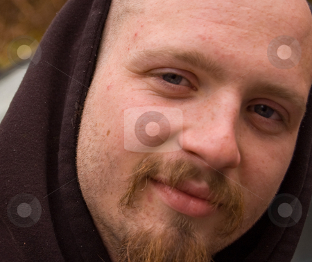 To use this stock image in your creative project, please select the size you need over to the right and click the "Add to Cart" button.
Your downloaded image will come with the Cutcaster watermark removed so don’t worry about the watermark you see on this page. Closeup of Young Caucasian Male stock photo, Closeup of a young Caucasian male mid 20's, hazel eyes, smiling and a raggy goatee. by Valerie Garner