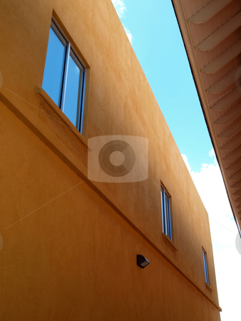 To use this stock image in your creative project, please select the size you need over to the right and click the "Add to Cart" button.
Your downloaded image will come with the Cutcaster watermark removed so don’t worry about the watermark you see on this page. Contemporary two story stucco building and windows stock photo, Contemporary stucco building with bue sky reflected in windows by Jill Reid