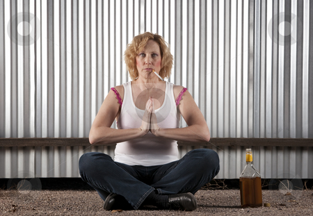 To use this stock image in your creative project, please select the size you need over to the right and click the "Add to Cart" button.
Your downloaded image will come with the Cutcaster watermark removed so don’t worry about the watermark you see on this page. Smoking and drinking woman meditating stock photo, Woman meditating with cigarette and tequila bottle by Scott Griessel