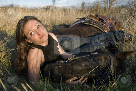 To use this stock image in your creative project, please select the size you need over to the right and click the "Add to Cart" button.
Your downloaded image will come with the Cutcaster watermark removed so don’t worry about the watermark you see on this page. Woman and horse in field stock photo, Young woman and her blackhorse laid down in a field by Bonzami Emmanuelle