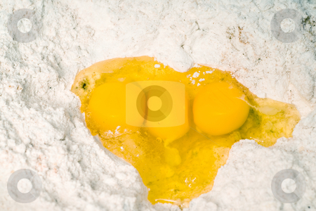 To use this stock image in your creative project, please select the size you need over to the right and click the "Add to Cart" button.
Your downloaded image will come with the Cutcaster watermark removed so don’t worry about the watermark you see on this page. Three Egg Yolks stock photo, Three egg yolks sitting in a hole in some baking flour by Richard Nelson