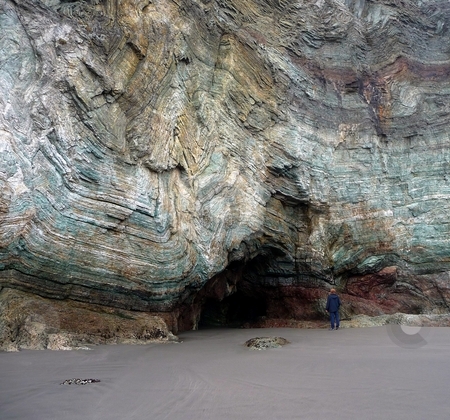 To use this stock image in your creative project, please select the size you need over to the right and click the "Add to Cart" button.
Your downloaded image will come with the Cutcaster watermark removed so don’t worry about the watermark you see on this page. Man vs Rainbow Rock stock photo, An adult man stands at the opening to a cave at Rainbow Rock in Oregon by Jill Reid