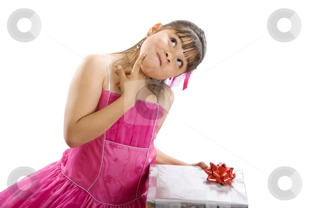To use this stock image in your creative project, please select the size you need over to the right and click the "Add to Cart" button.
Your downloaded image will come with the Cutcaster watermark removed so don’t worry about the watermark you see on this page. I wonder what I got this time.... stock photo, Studio shot of endearing girl with gift wearing fancy dress - Isolated on white by iodrakon