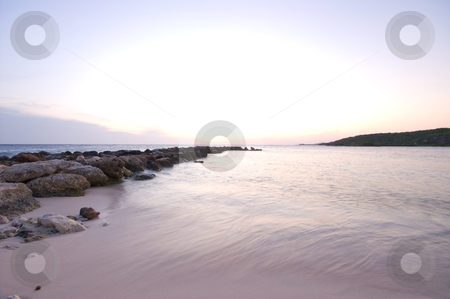 To use this stock image in your creative project, please select the size you need over to the right and click the "Add to Cart" button.
Your downloaded image will come with the Cutcaster watermark removed so don’t worry about the watermark you see on this page. Sunset over the sea with wave breaker stock photo, Purple blue sea sunset with a rock wave breaker by Karin Claus