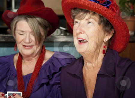 To use this stock image in your creative project, please select the size you need over to the right and click the "Add to Cart" button.
Your downloaded image will come with the Cutcaster watermark removed so don’t worry about the watermark you see on this page. Ladies wearing red hats playing cards stock photo, Ladies wearing red hats playing a hand of cards by Scott Griessel