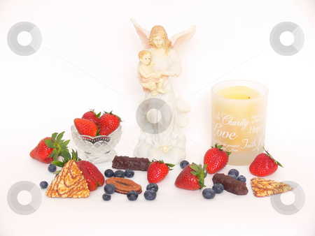To use this stock image in your creative project, please select the size you need over to the right and click the "Add to Cart" button.
Your downloaded image will come with the Cutcaster watermark removed so don’t worry about the watermark you see on this page. Strawberry, candles, Maria, chocolate, blueberry stock photo, An display of fruit, a round candle holder and Maria with Jesus
on white background. by Horst Petzold