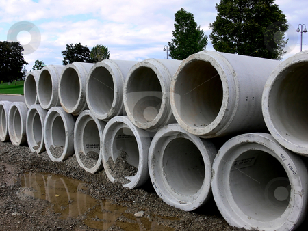 To use this stock image in your creative project, please select the size you need over to the right and click the "Add to Cart" button.
Your downloaded image will come with the Cutcaster watermark removed so don’t worry about the watermark you see on this page. Concrete pipe stock photo, A stack of concrete pipes on a road construction site. by Horst Petzold