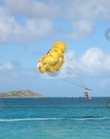 To use this stock image in your creative project, please select the size you need over to the right and click the "Add to Cart" button.
Your downloaded image will come with the Cutcaster watermark removed so don’t worry about the watermark you see on this page. Parasailing in the Caribbean stock photo, A view of parasailing in the Caribbean, just off the island of St. Maarten on a beautiful afternoon in January by Ray Carpenter
