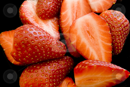 To use this stock image in your creative project, please select the size you need over to the right and click the "Add to Cart" button.
Your downloaded image will come with the Cutcaster watermark removed so don’t worry about the watermark you see on this page. Strawberries on black stock photo, An arrangement of sliced strawberries on a black background by Stephen Gibson