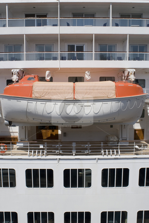 To use this stock image in your creative project, please select the size you need over to the right and click the "Add to Cart" button.
Your downloaded image will come with the Cutcaster watermark removed so don’t worry about the watermark you see on this page. Life boat stock photo, A cruise ship lifeboat, concept of a safe haven or a backup plan by Stephen Gibson