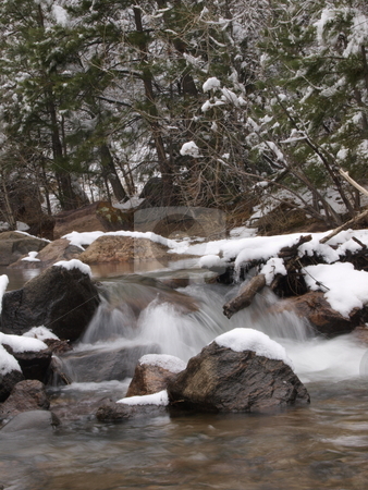 To use this stock image in your creative project, please select the size you need over to the right and click the "Add to Cart" button.
Your downloaded image will come with the Cutcaster watermark removed so don’t worry about the watermark you see on this page. Winter River stock photo, A color image of a mountain river during winter. by Michael Rice