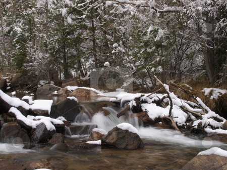 To use this stock image in your creative project, please select the size you need over to the right and click the "Add to Cart" button.
Your downloaded image will come with the Cutcaster watermark removed so don’t worry about the watermark you see on this page. Winter River stock photo, A color image of a mountain river during winter. by Michael Rice