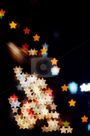 To use this stock image in your creative project, please select the size you need over to the right and click the "Add to Cart" button.
Your downloaded image will come with the Cutcaster watermark removed so don’t worry about the watermark you see on this page. Star-shaped lights stock photo, Night lights blurred into star-shaped bokeh by Martin Darley