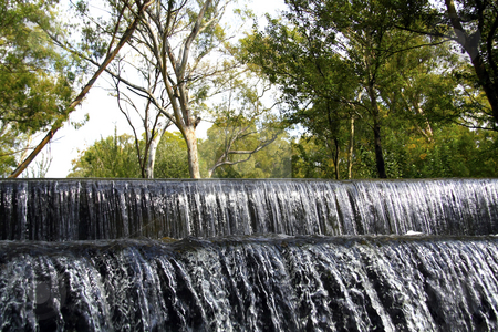 To use this stock image in your creative project, please select the size you need over to the right and click the "Add to Cart" button.
Your downloaded image will come with the Cutcaster watermark removed so don’t worry about the watermark you see on this page. Two-layered waterfall in a nature reserve stock photo, Two-layered waterfall in a nature reserve by Chris Alleaume