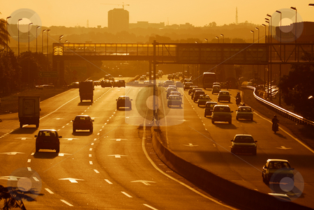 To use this stock image in your creative project, please select the size you need over to the right and click the "Add to Cart" button.
Your downloaded image will come with the Cutcaster watermark removed so don’t worry about the watermark you see on this page. Busy Highway stock photo, Highway during sunset by Jaggat Images