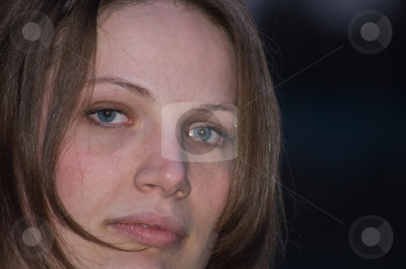 To use this stock image in your creative project, please select the size you need over to the right and click the "Add to Cart" button.
Your downloaded image will come with the Cutcaster watermark removed so don’t worry about the watermark you see on this page. Brown Hair Blue Eyed Young Woman Closeup stock photo, Brown hair and blue eyed young adult woman is featured in this photo against a dark sky backdrop. by Valerie Garner