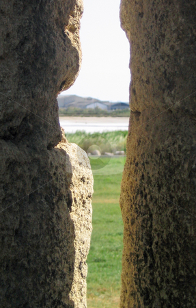 To use this stock image in your creative project, please select the size you need over to the right and click the "Add to Cart" button.
Your downloaded image will come with the Cutcaster watermark removed so don’t worry about the watermark you see on this page. View of countryside through stone stock photo, View of countrysideas seen through a space in a stone wall by Jaime Pharr