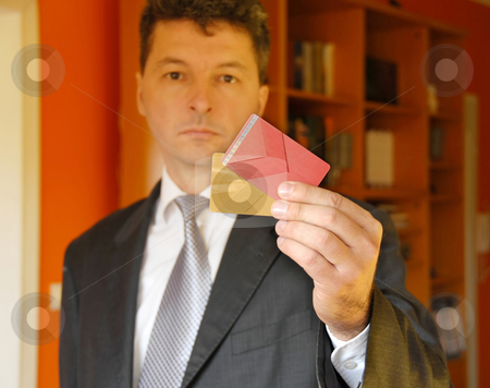 To use this stock image in your creative project, please select the size you need over to the right and click the "Add to Cart" button.
Your downloaded image will come with the Cutcaster watermark removed so don’t worry about the watermark you see on this page. Businessman with credit cards stock photo, Mature businessman holding plastic credit cards in hand by Julija Sapic